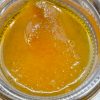 Close-up of live resin cannabis extract concentrate with amber texture